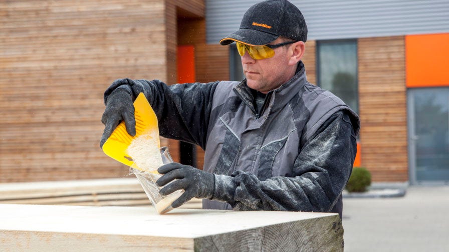 Sawyer measuring sawdust