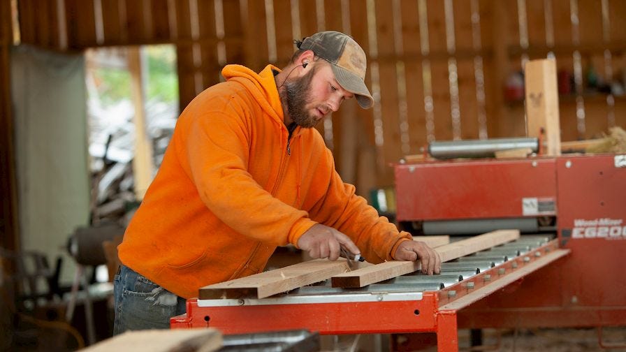  Luke using Wood-Mizer EG200 board edger 